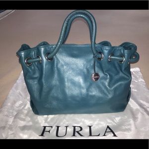 Turquoise Furla handbag.